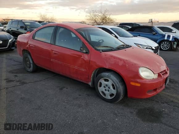 2002 Dodge Neon with VIN 1B3ES26C22D520419, listed as a Copart auction lot 84113104 with 129,714 mi miles and Salvage title. Bid and sale history available at DreamBid. Image 4.