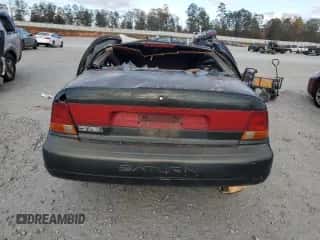 1999 Saturn SL with VIN 1G8ZJ5276XZ106206, listed as a Copart auction lot 75212184 with Not provided miles and Salvage title. Bid and sale history available at DreamBid. Image 6.