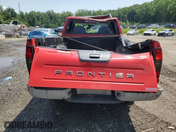 2003 Nissan Frontier SVE with VIN 1N6MD29Y43C411380, listed as a Copart auction lot 64013085 with 95,252 mi miles and Salvage title. Bid and sale history available at DreamBid. Image 6.