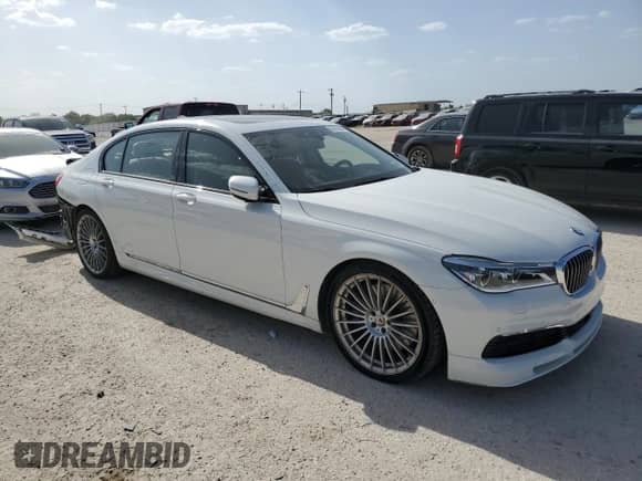 2019 BMW 7 Series with VIN WBA7F2C15KB242462, listed as a Copart auction lot 60916394 with 20,985 mi miles and Salvage title. Bid and sale history available at DreamBid. Image 4.