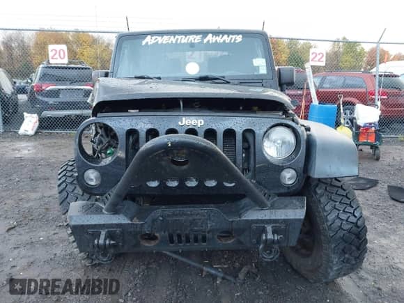 2014 Jeep Wrangler Sport z VIN 1C4AJWAG1EL327481, wystawiony jako IAAI lot #43527216 z przebiegiem 162 278 mil mil oraz . Historia ofert i sprzedaży dostępna na DreamBid. Obrazek 13.