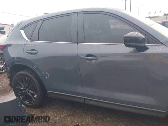2023 Mazda CX-5 S Carbon Edition z VIN JM3KFBCM7P0104374, wystawiony jako IAAI lot #42329421 z przebiegiem 27 575 mil mil oraz . Historia ofert i sprzedaży dostępna na DreamBid. Obrazek 13.