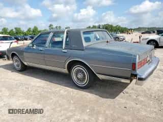 1989 Chevrolet Caprice с VIN 1G1BU51E1KA127303, выставлен на аукционе Copart как лот 61016775 с пробегом 3 823 миль миль и Чистый • Clean title. История ставок и продаж доступна на DreamBid. Изображение 2.