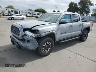 2019 Toyota Tacoma TRD Off Road with VIN 3TMCZ5AN7KM210332, listed as a Copart auction lot 81743135 with 90,681 mi miles and Salvage title. Bid and sale history available at DreamBid. Image 1.