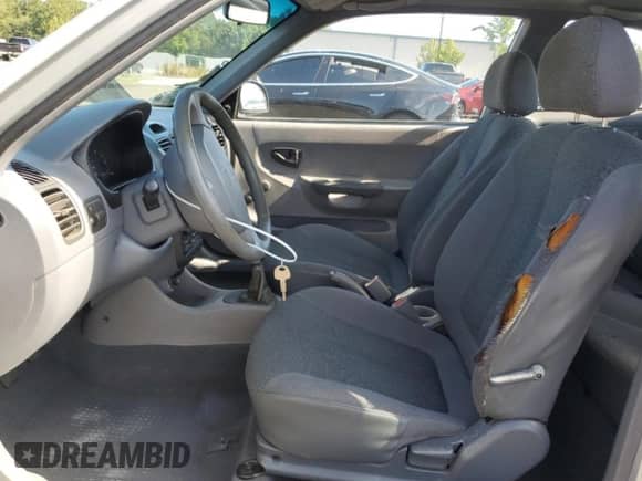 2002 Hyundai Accent z VIN KMHCF35G72U217653, wystawiony jako Copart lot #70099915 z przebiegiem 168 308 mil mil oraz Szkoda całkowita • Salvage title. Historia ofert i sprzedaży dostępna na DreamBid. Obrazek 7.