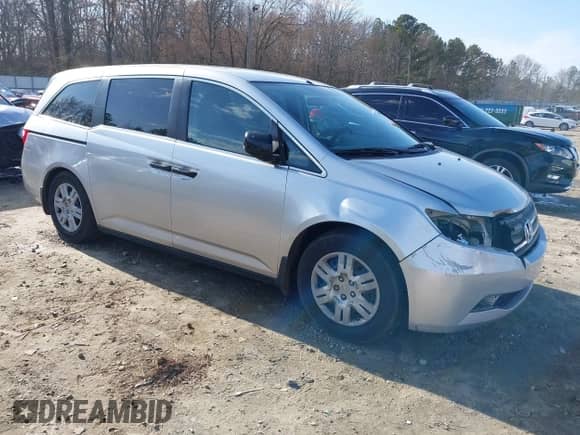 2012 Honda Odyssey LX with VIN 5FNRL5H29CB054971, listed as a IAAI auction lot 41582882 with 261,874 mi miles and . Bid and sale history available at DreamBid. Image 1.