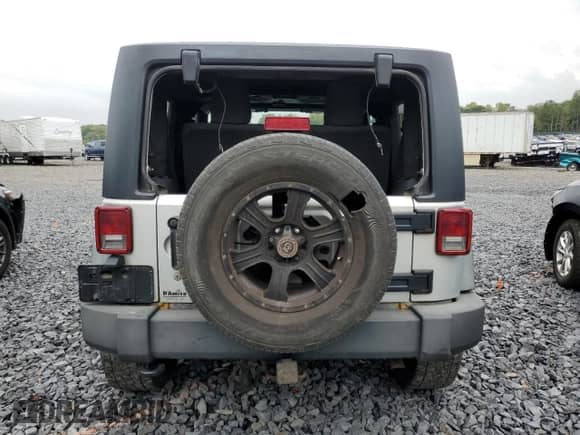 2012 Jeep Wrangler Sport z VIN 1C4AJWAG6CL228765, wystawiony jako Copart lot #80979855 z przebiegiem 216 434 mil mil oraz Szkoda całkowita • Salvage title. Historia ofert i sprzedaży dostępna na DreamBid. Obrazek 6.