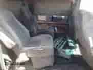 1999 Ford Econoline Cargo z VIN 1FDRE14W5XHC18732, wystawiony jako Copart lot #53006945 z przebiegiem 300 748 mil mil oraz Nie do naprawy • Non repairable. Historia ofert i sprzedaży dostępna na DreamBid. Obrazek 11.