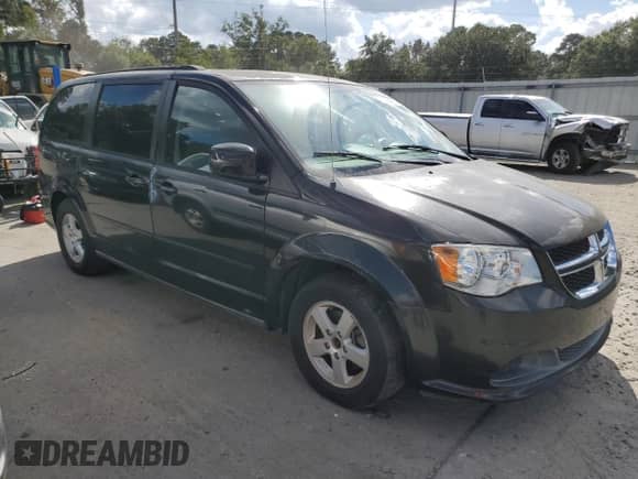 2012 Dodge Grand Caravan SXT with VIN 2C4RDGCG4CR104207, listed as a Copart auction lot 81743065 with 93,016 mi miles and Clean title. Bid and sale history available at DreamBid. Image 4.