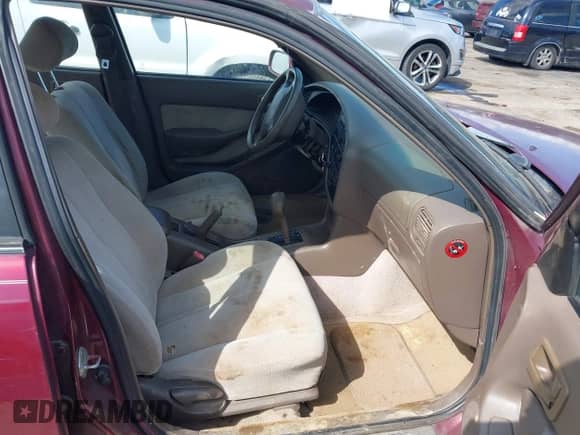 1996 Toyota Camry DX z VIN 4T1BG12K5TU756036, wystawiony jako IAAI lot #43304027 z przebiegiem 128 756 mil mil oraz . Historia ofert i sprzedaży dostępna na DreamBid. Obrazek 5.