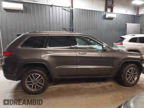 2021 Jeep Grand Cherokee 80th Anniversary with VIN 1C4RJFBG2MC767757, listed as a IAAI auction lot 42008442 with 98,227 mi miles and . Bid and sale history available at DreamBid. Image 14.