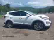 2014 Hyundai Santa Fe with VIN 5XYZWDLA1EG225384, listed as a IAAI auction lot 42518990 with 99,125 mi miles and . Bid and sale history available at DreamBid. Image 13.