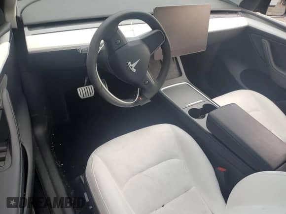 2023 Tesla Model Y Performance with VIN 7SAYGDEF0PF808883, listed as a Copart auction lot 82106605 with 22,706 mi miles and Salvage title. Bid and sale history available at DreamBid. Image 8.