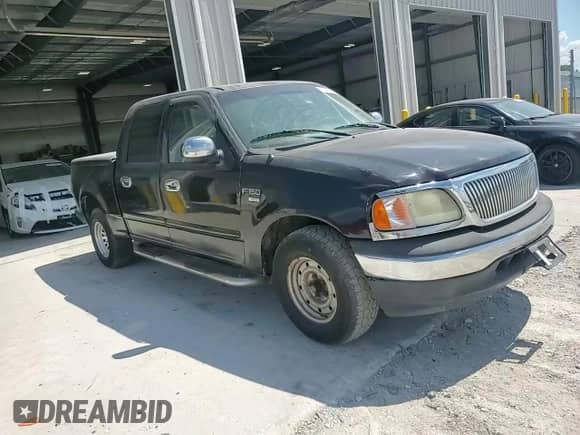 2002 Ford F-150 XLT с VIN 1FTRW07L22KB04146, выставлен на аукционе Copart как лот 69320515 с пробегом 189 839 миль миль и Списание • Salvage title. История ставок и продаж доступна на DreamBid. Изображение 13.