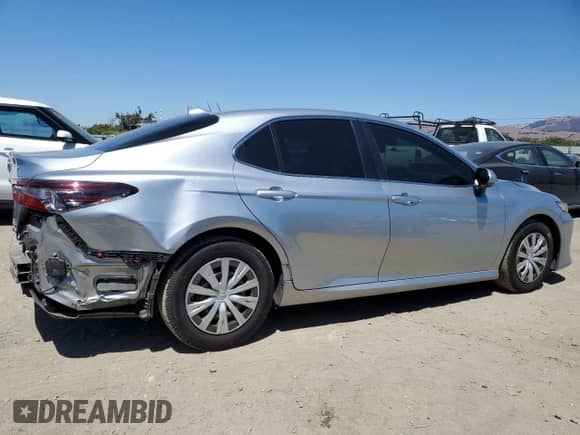 2024 Toyota Camry Hybrid LE с VIN 4T1H31AK6RU629344, выставлен на аукционе Copart как лот 69148465 с пробегом 95 385 миль миль и Списание • Salvage title. История ставок и продаж доступна на DreamBid. Изображение 3.