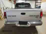 2003 Dodge Dakota Sport with VIN 1D7HG38X83S300059, listed as a Copart auction lot 61420305 with 230,971 mi miles and Salvage title. Bid and sale history available at DreamBid. Image 6.
