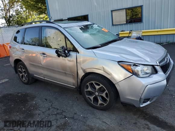 2015 Subaru Forester XT Touring with VIN JF2SJGUC1FH593818, listed as a Copart auction lot 59205455 with 56,610 mi miles and Salvage title. Bid and sale history available at DreamBid. Image 4.