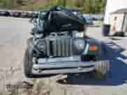 2002 Jeep Wrangler X z VIN 1J4FA39S12P776350, wystawiony jako Copart lot #82276415 z przebiegiem 196 023 mil mil oraz Szkoda całkowita • Salvage title. Historia ofert i sprzedaży dostępna na DreamBid. Obrazek 5.