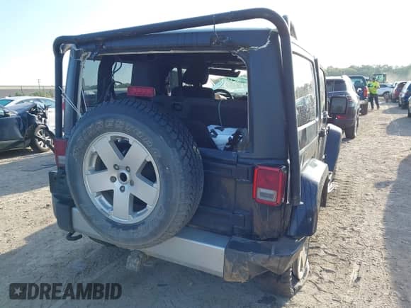 2011 Jeep Wrangler Sahara with VIN 1J4AA5D10BL511947, listed as a IAAI auction lot 43227627 with 168,984 mi miles and . Bid and sale history available at DreamBid. Image 4.