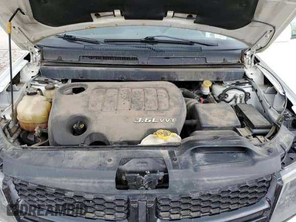 2014 Dodge Journey Crossroad z VIN 3C4PDCGG6ET289550, wystawiony jako Copart lot #66448865 z przebiegiem 193 314 mil mil oraz Szkoda całkowita • Salvage title. Historia ofert i sprzedaży dostępna na DreamBid. Obrazek 12.