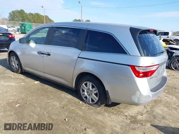 2012 Honda Odyssey LX with VIN 5FNRL5H29CB054971, listed as a IAAI auction lot 41582882 with 261,874 mi miles and . Bid and sale history available at DreamBid. Image 3.