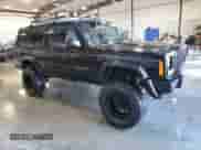 1998 Jeep Grand Cherokee with VIN 1J4FJ27P2WL203592, listed as a Copart auction lot 82803884 with 82,604 mi miles and Salvage title. Bid and sale history available at DreamBid. Image 4.