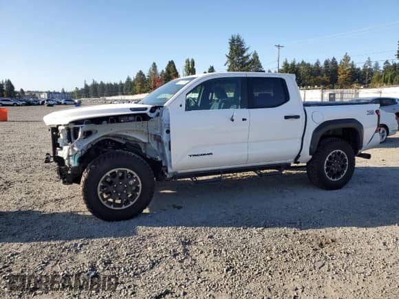 2025 Toyota Tacoma TRD Sport Hybrid with VIN 3TYLC5LN6ST020699, listed as a Copart auction lot 82133585 with 3,277 mi miles and Salvage title. Bid and sale history available at DreamBid. Image 1.