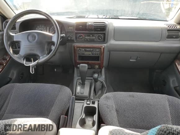 1998 Honda Passport LX with VIN 4S6CM58W2W4403473, listed as a Copart auction lot 66621474 with 154,892 mi miles and Clean title. Bid and sale history available at DreamBid. Image 8.