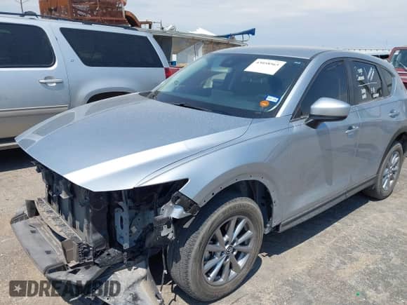 2022 Mazda CX-5 S Select z VIN JM3KFBBMXN0638208, wystawiony jako IAAI lot #43058565 z przebiegiem 34 039 mil mil oraz . Historia ofert i sprzedaży dostępna na DreamBid. Obrazek 18.