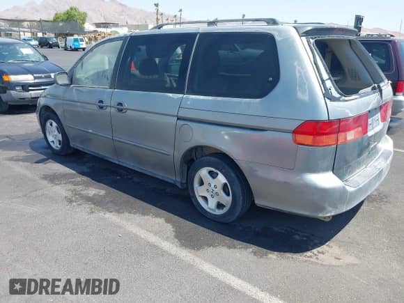 1999 Honda Odyssey EX with VIN 2HKRL1864XH525993, listed as a IAAI auction lot 43000052 with 173,223 mi miles and . Bid and sale history available at DreamBid. Image 3.
