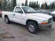2002 Dodge Dakota with VIN 1B7GL16X82S701537, listed as a IAAI auction lot 43498115 with 144,948 mi miles and . Bid and sale history available at DreamBid. Image 1.