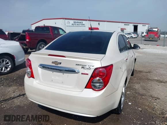 2014 Chevrolet Sonic LTZ with VIN 1G1JE5SB6E4132271, listed as a IAAI auction lot 41867508 with 115,116 mi miles and . Bid and sale history available at DreamBid. Image 4.