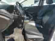 2013 Ford Focus Titanium z VIN 1FADP3J25DL168564, wystawiony jako Copart lot #80250465 z przebiegiem 111 505 mil mil oraz Szkoda całkowita • Salvage title. Historia ofert i sprzedaży dostępna na DreamBid. Obrazek 7.