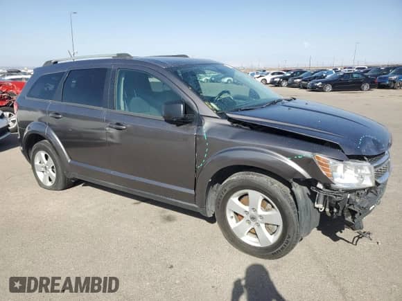 2018 Dodge Journey SE with VIN 3C4PDCABXJT375709, listed as a Copart auction lot 85906354 with 104,489 mi miles and Non repairable. Bid and sale history available at DreamBid. Image 4.