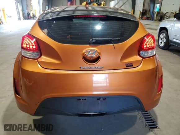 2014 Hyundai Veloster z VIN KMHTC6AD4EU212324, wystawiony jako Copart lot #71514455 z przebiegiem 120 419 mil mil oraz Czysty tytuł • Clean title. Historia ofert i sprzedaży dostępna na DreamBid. Obrazek 6.