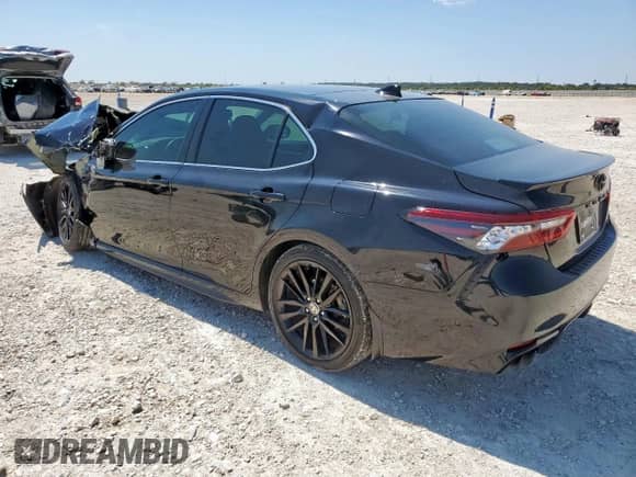 2021 Toyota Camry XSE with VIN 4T1K61AK9MU402834, listed as a Copart auction lot 71657335 with 77,028 mi miles and Salvage title. Bid and sale history available at DreamBid. Image 2.