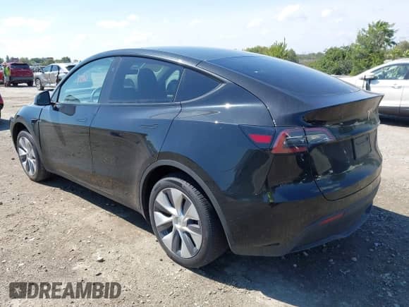 2023 Tesla Model Y Long Range z VIN 7SAYGDEE0PA201841, wystawiony jako IAAI lot #43158634 z przebiegiem 10 356 mil mil oraz . Historia ofert i sprzedaży dostępna na DreamBid. Obrazek 3.