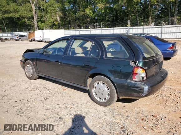 1997 Saturn SW with VIN 1G8ZK8278VZ379899, listed as a Copart auction lot 74913664 with 126,186 mi miles and Salvage title. Bid and sale history available at DreamBid. Image 2.