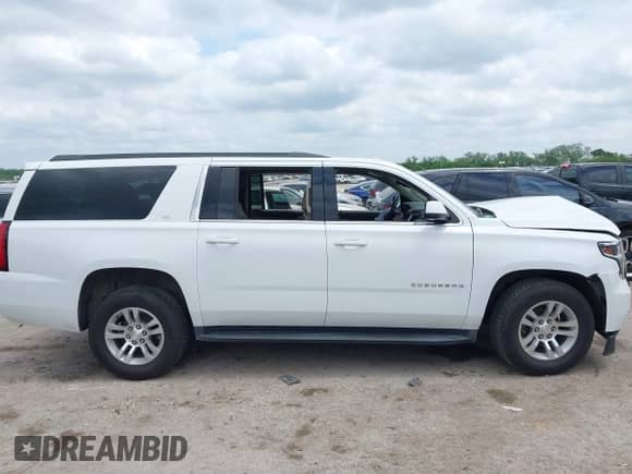 2017 Chevrolet Suburban LT with VIN 1GNSCHKC7HR115215, listed as a IAAI auction lot 42140471 with 153,705 mi miles and . Bid and sale history available at DreamBid. Image 13.