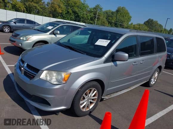2014 Dodge Grand Caravan SXT with VIN 2C4RDGCG1ER347556, listed as a IAAI auction lot 43221709 with 245,875 mi miles and . Bid and sale history available at DreamBid. Image 2.