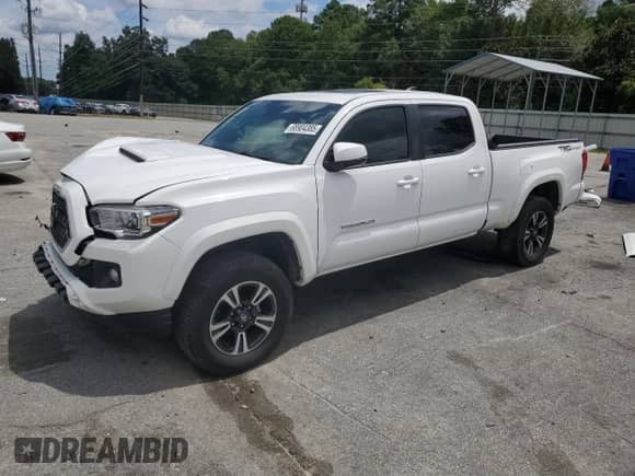 2018 Toyota Tacoma SR5 с VIN 3TMBZ5DN3JM016239, выставлен на аукционе Copart как лот 68904385 с пробегом 77 131 миль миль и Списание • Salvage title. История ставок и продаж доступна на DreamBid. Изображение 1.
