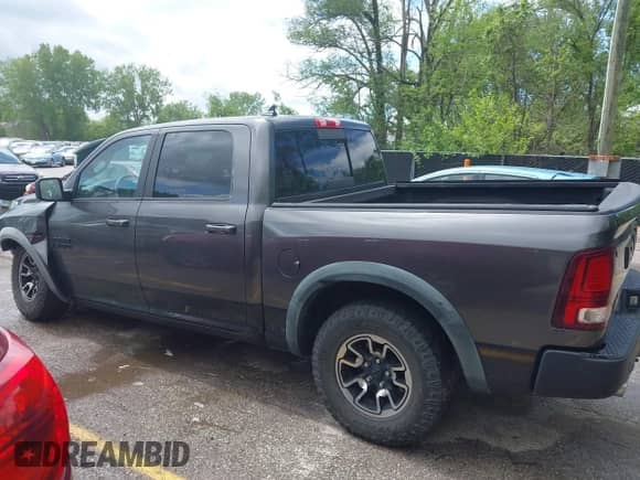 2015 Ram 1500 Rebel with VIN 1C6RR7YTXFS785507, listed as a IAAI auction lot 42172925 with 100,201 mi miles and . Bid and sale history available at DreamBid. Image 14.