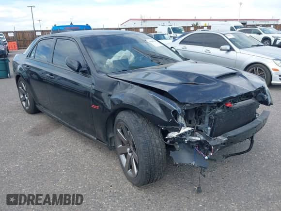 2014 Chrysler 300 SRT-8 with VIN 2C3CCAFJ9EH171489, listed as a IAAI auction lot 43108178 with 122,509 mi miles and . Bid and sale history available at DreamBid. Image 1.