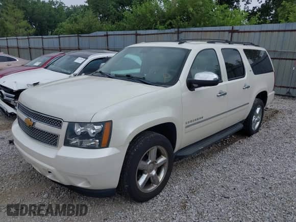 2014 Chevrolet Suburban LTZ with VIN 1GNSKKE79ER218727, listed as a IAAI auction lot 42761610 with 242,771 mi miles and . Bid and sale history available at DreamBid. Image 18.