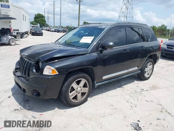 2010 Jeep Compass Sport z VIN 1J4NT1FBXAD621214, wystawiony jako IAAI lot #42227325 z przebiegiem 68 910 mil mil oraz . Historia ofert i sprzedaży dostępna na DreamBid. Obrazek 17.