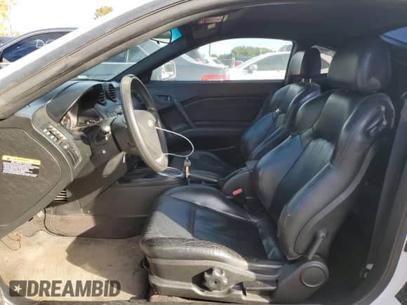2003 Hyundai Tiburon GT с VIN KMHHN65FX3U096958, выставлен на аукционе Copart как лот 75451144 с пробегом 200 579 миль миль и Списание • Salvage title. История ставок и продаж доступна на DreamBid. Изображение 7.