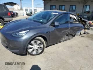 2020 Tesla Model Y Long Range с VIN 5YJYGDEE5LF020261, выставлен на аукционе Copart как лот 70729315 с пробегом 74 406 миль миль и Списание • Salvage title. История ставок и продаж доступна на DreamBid. Изображение 1.