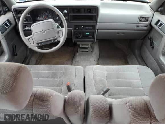 1993 Dodge Spirit with VIN 3B3XA4632PT520185, listed as a Copart auction lot 54891565 with 125,574 mi miles and Salvage title. Bid and sale history available at DreamBid. Image 8.