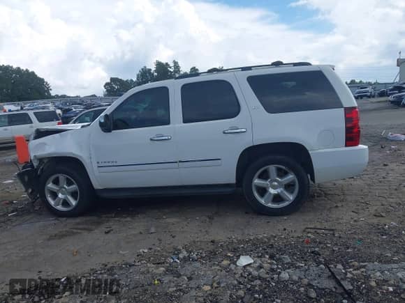 2009 Chevrolet Tahoe LTZ with VIN 1GNFC33099J123390, listed as a IAAI auction lot 42793918 with 206,967 mi miles and . Bid and sale history available at DreamBid. Image 14.
