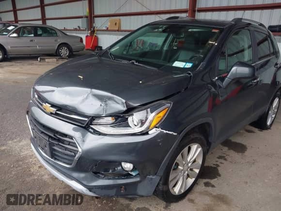 2017 Chevrolet Trax Premier z VIN 3GNCJRSB4HL248531, wystawiony jako IAAI lot #42296367 z przebiegiem 170 258 mil mil oraz . Historia ofert i sprzedaży dostępna na DreamBid. Obrazek 6.